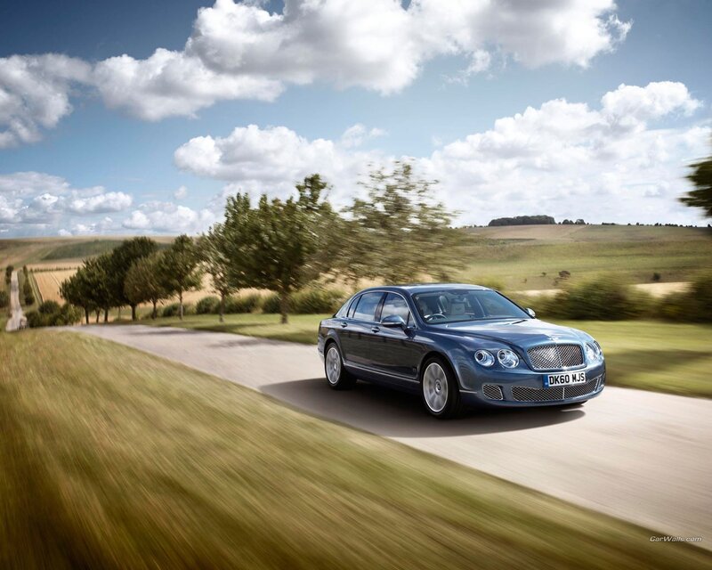 Bentley driving on country road
