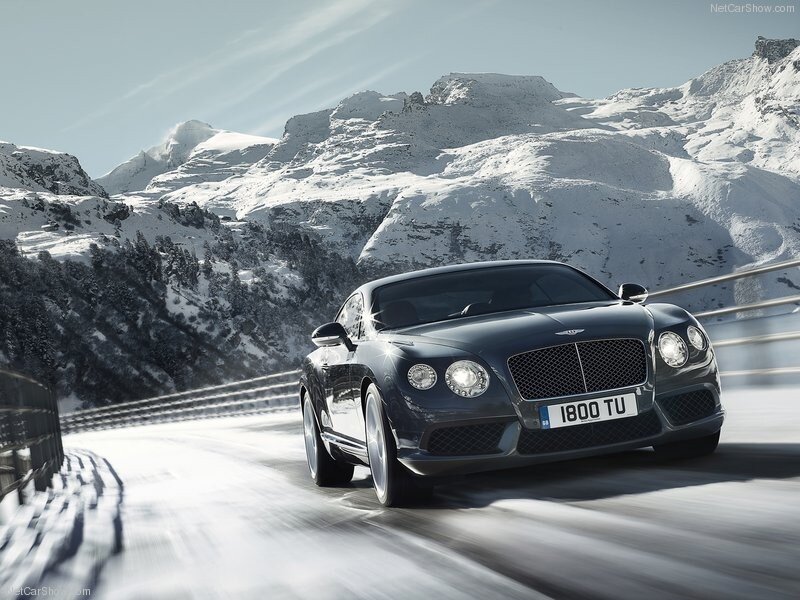 Bentley driving on snowy mountain road