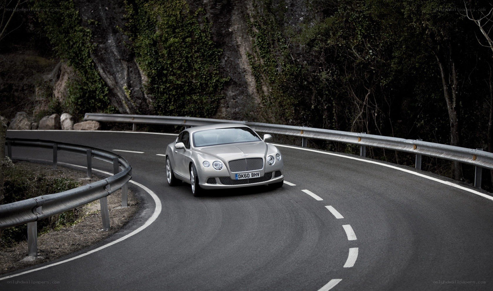 Bentley driving on winding road