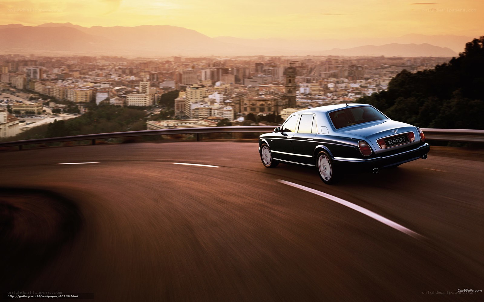 Bentley driving on winding road