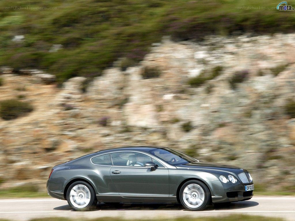 Bentley flying along a road
