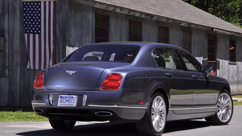 Bentley Flying Spur parked outside barn