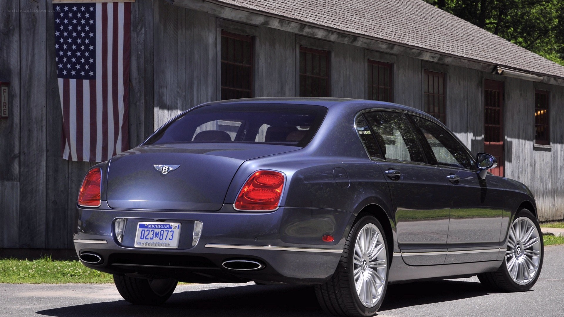 Bentley Flying Spur parked outside barn