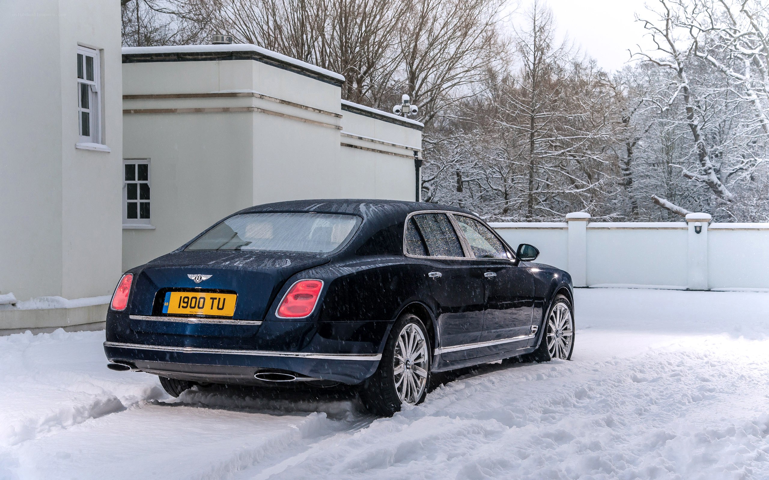 Bentley in snowy driveway