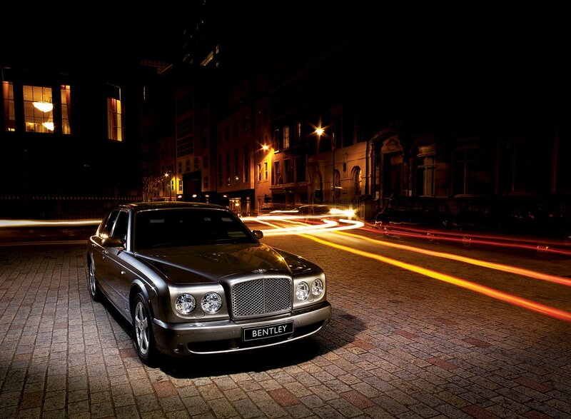 Bentley on a city street at night