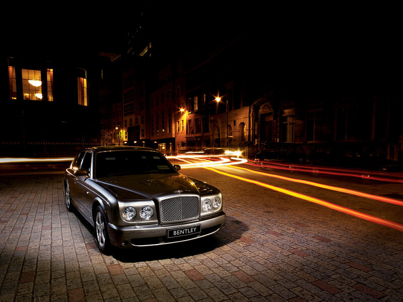 Bentley on a city street at night