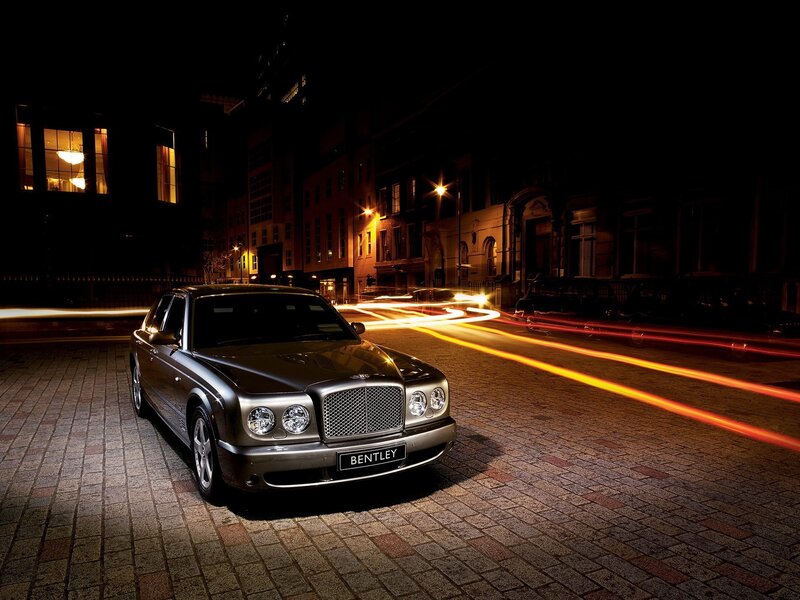 Bentley on a city street at night