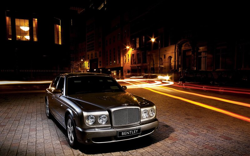 Bentley on a city street at night