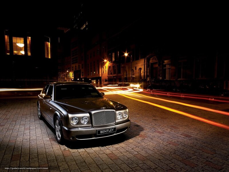 Bentley on a city street at night