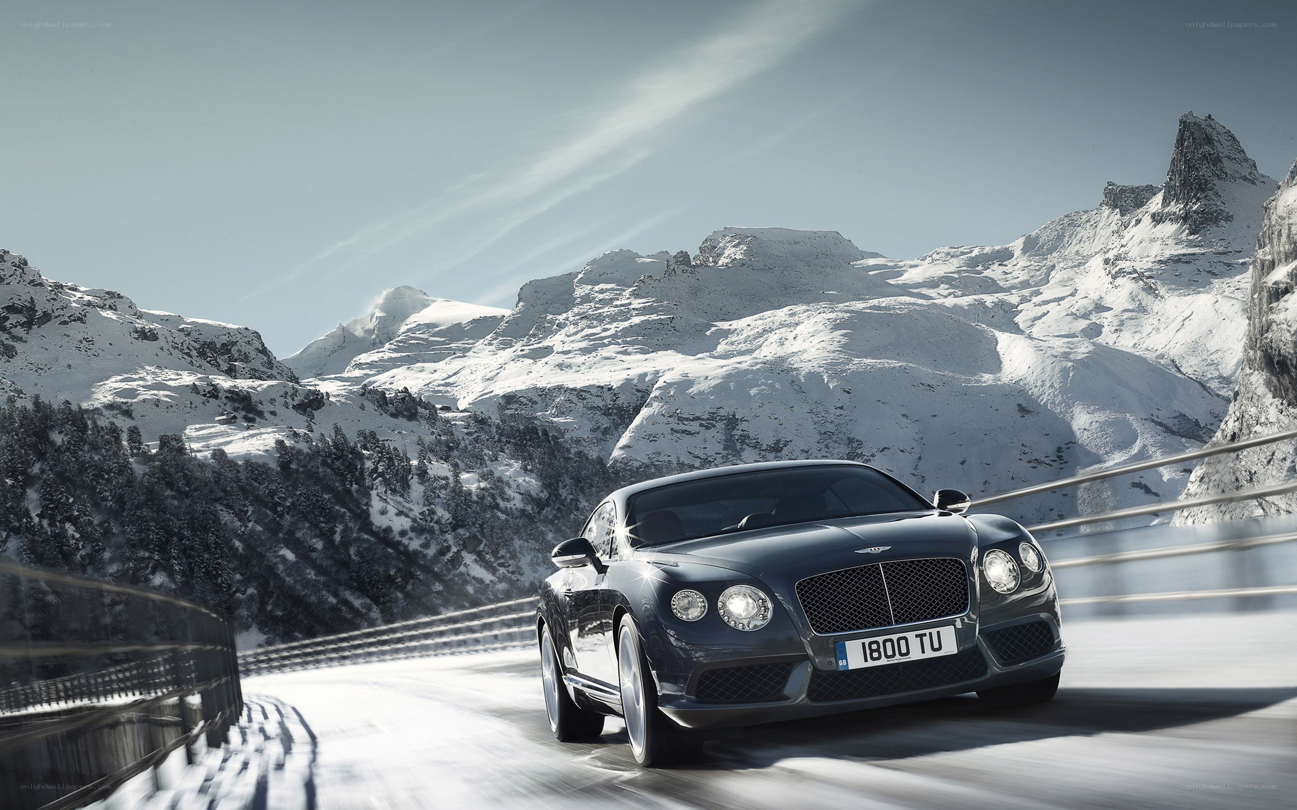 Bentley on a snowy mountain road