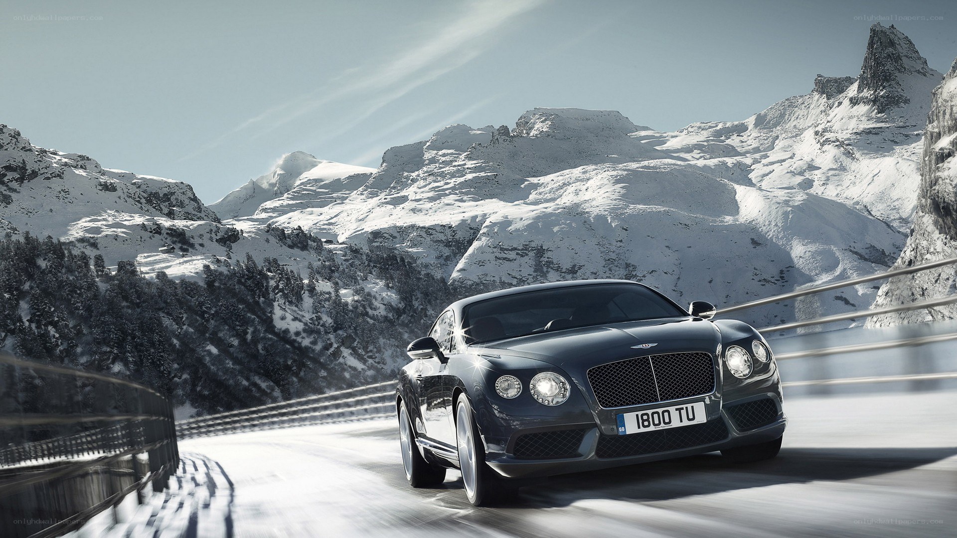 Bentley on a snowy mountain road