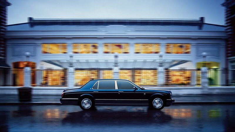 Bentley on a wet city street