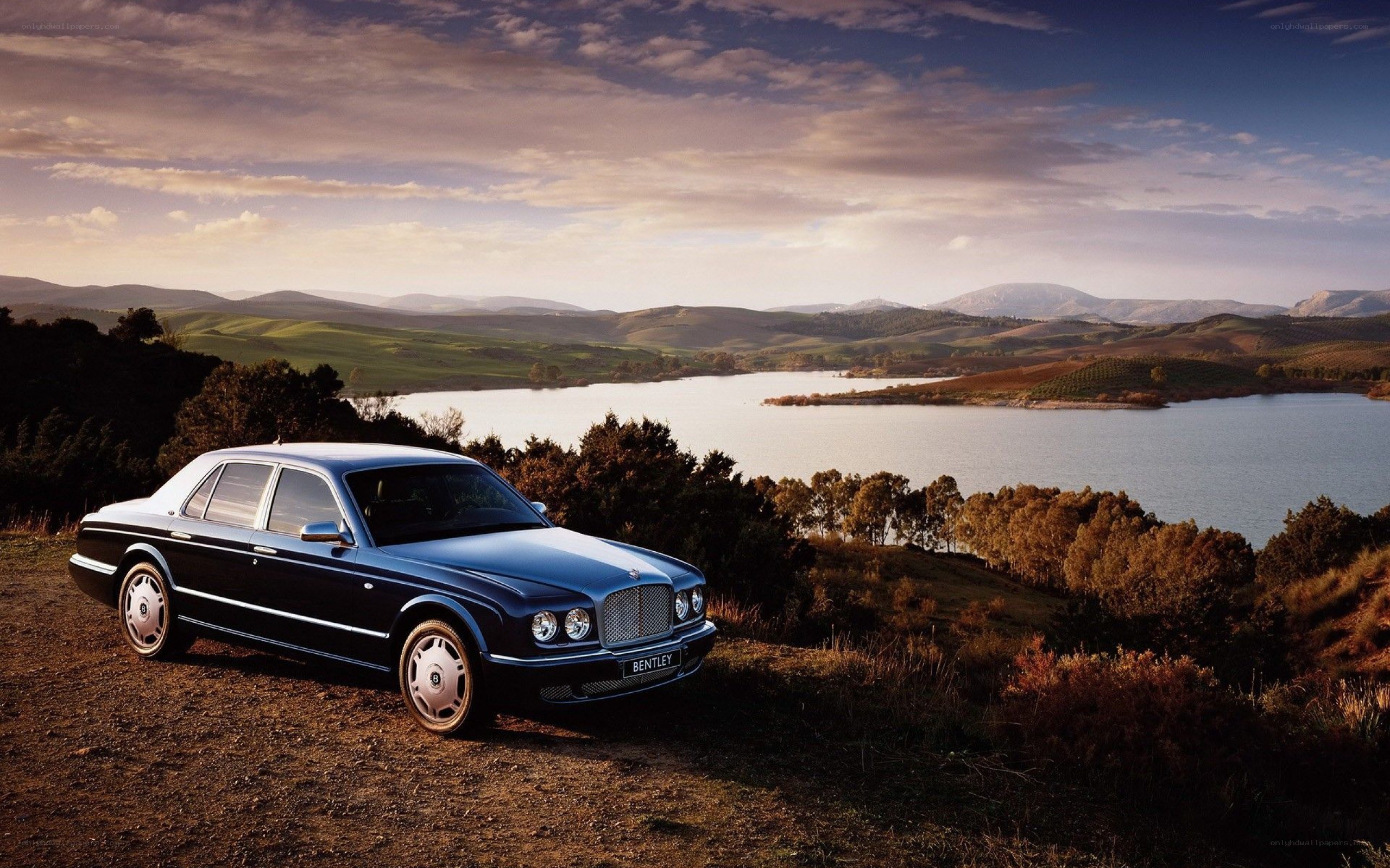 Bentley parked by a lake