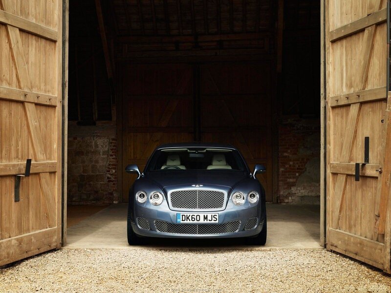 Bentley parked in a barn