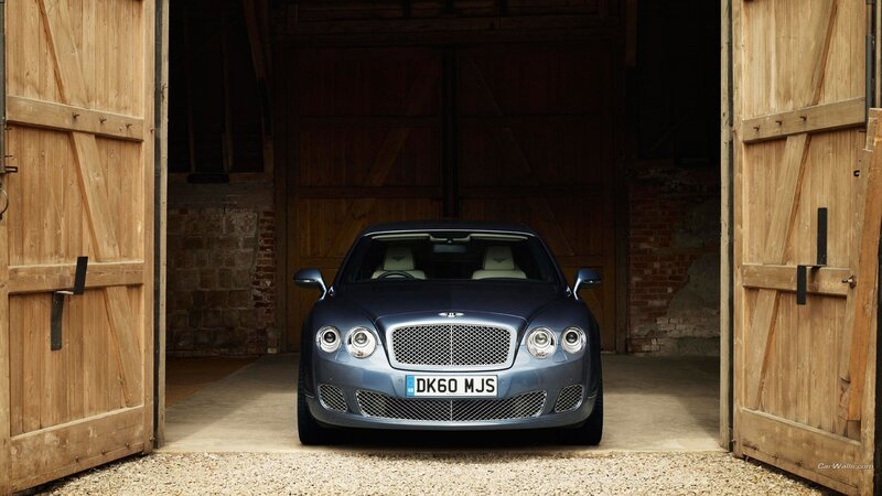 Bentley parked in a barn