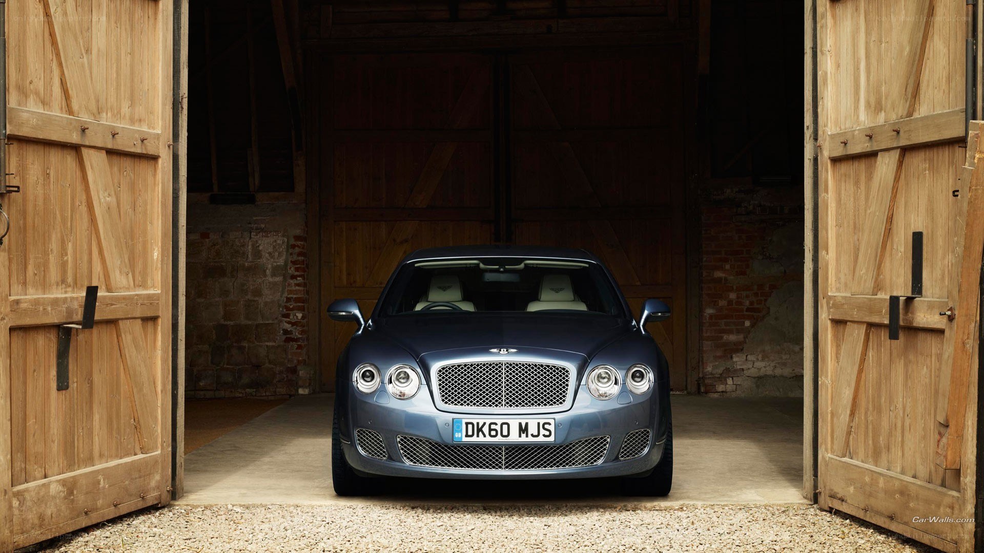 Bentley parked in a barn