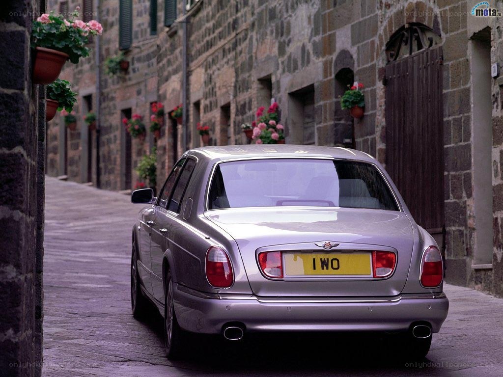 Bentley parked in a narrow street
