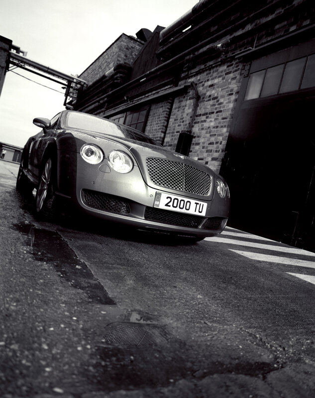 Bentley parked in industrial area