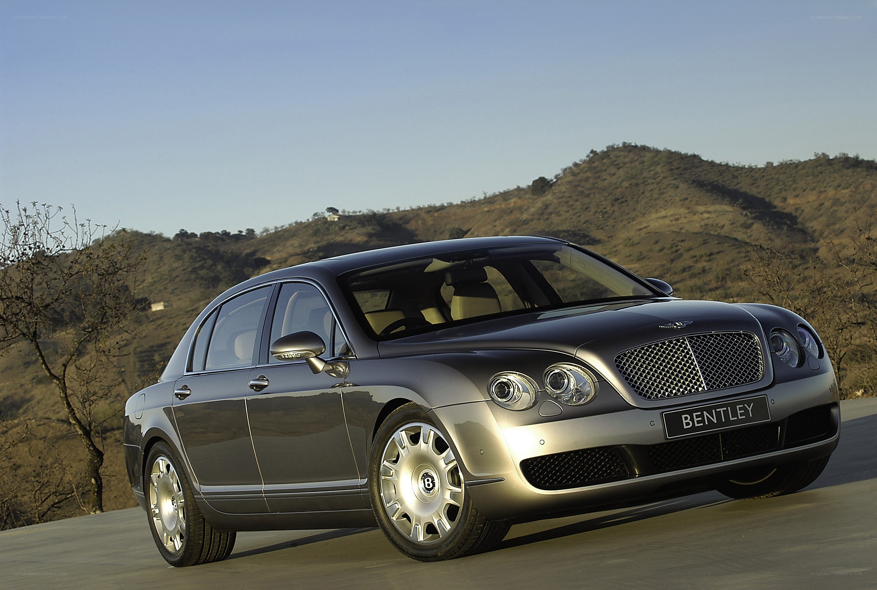 Bentley sedan on a hillside road