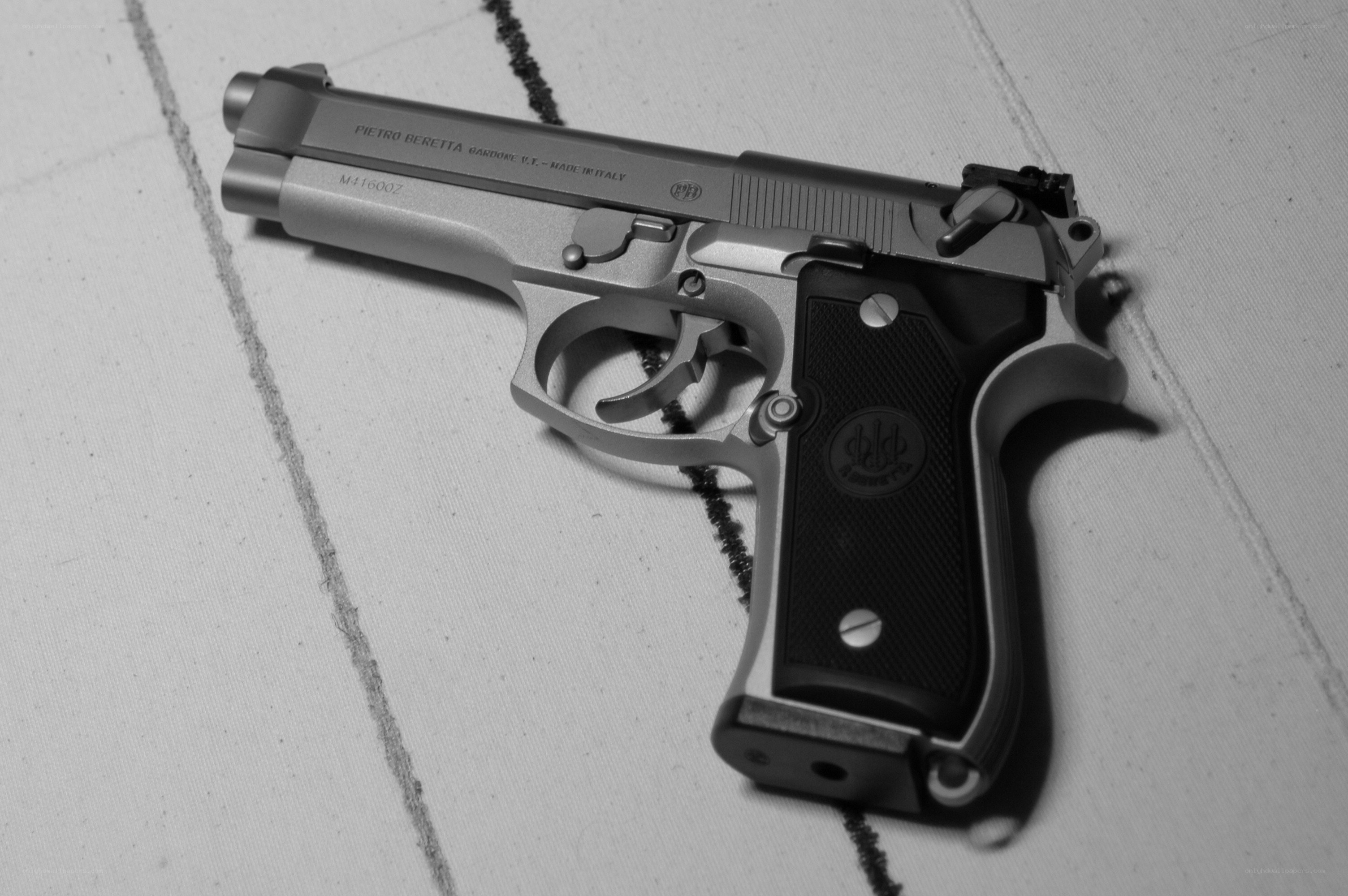 Beretta pistol on fabric