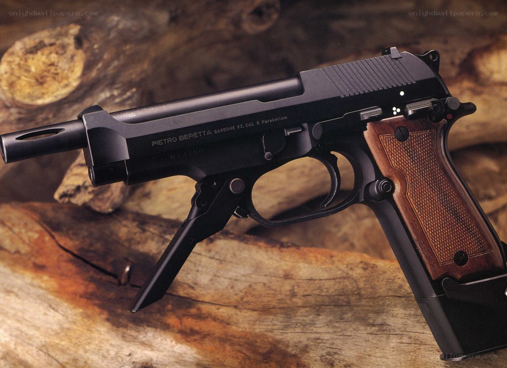 Beretta pistol on wood