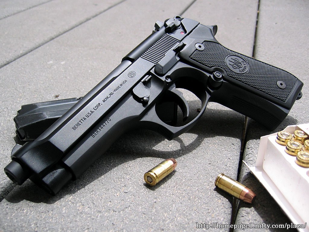 Beretta pistol with ammunition