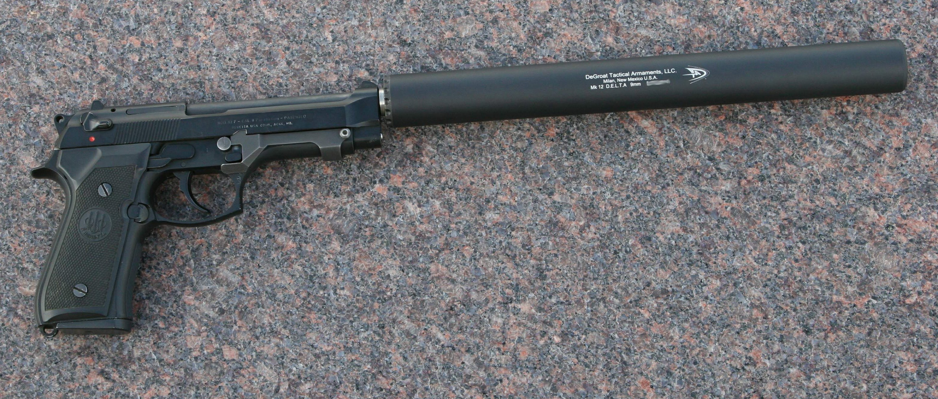 Beretta pistol with suppressor