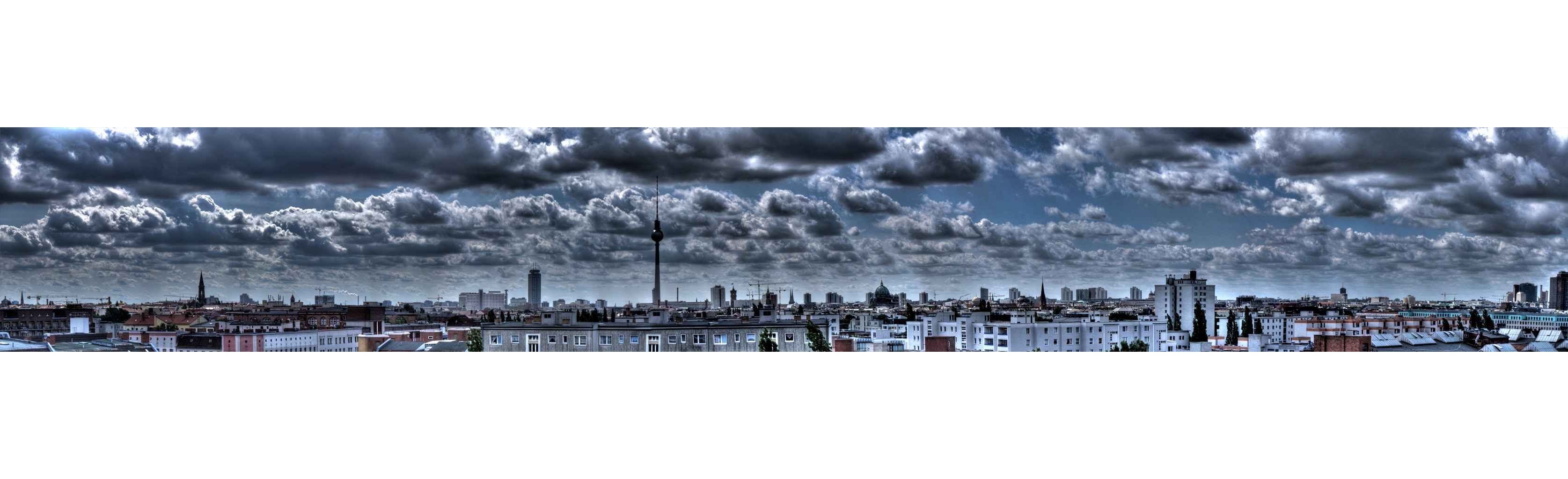 Berlin skyline under stormy sky