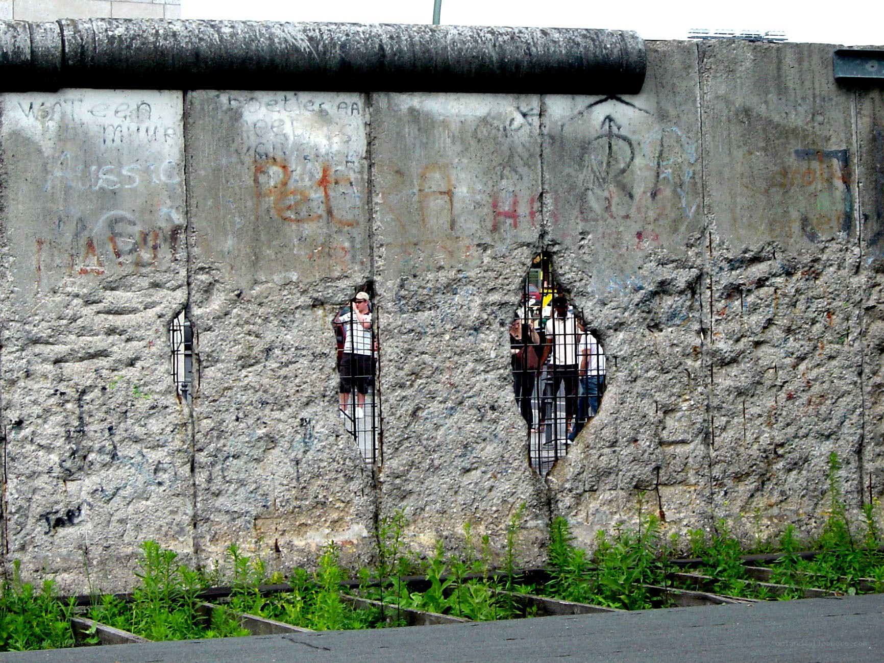 Berlin Wall with graffiti and holes