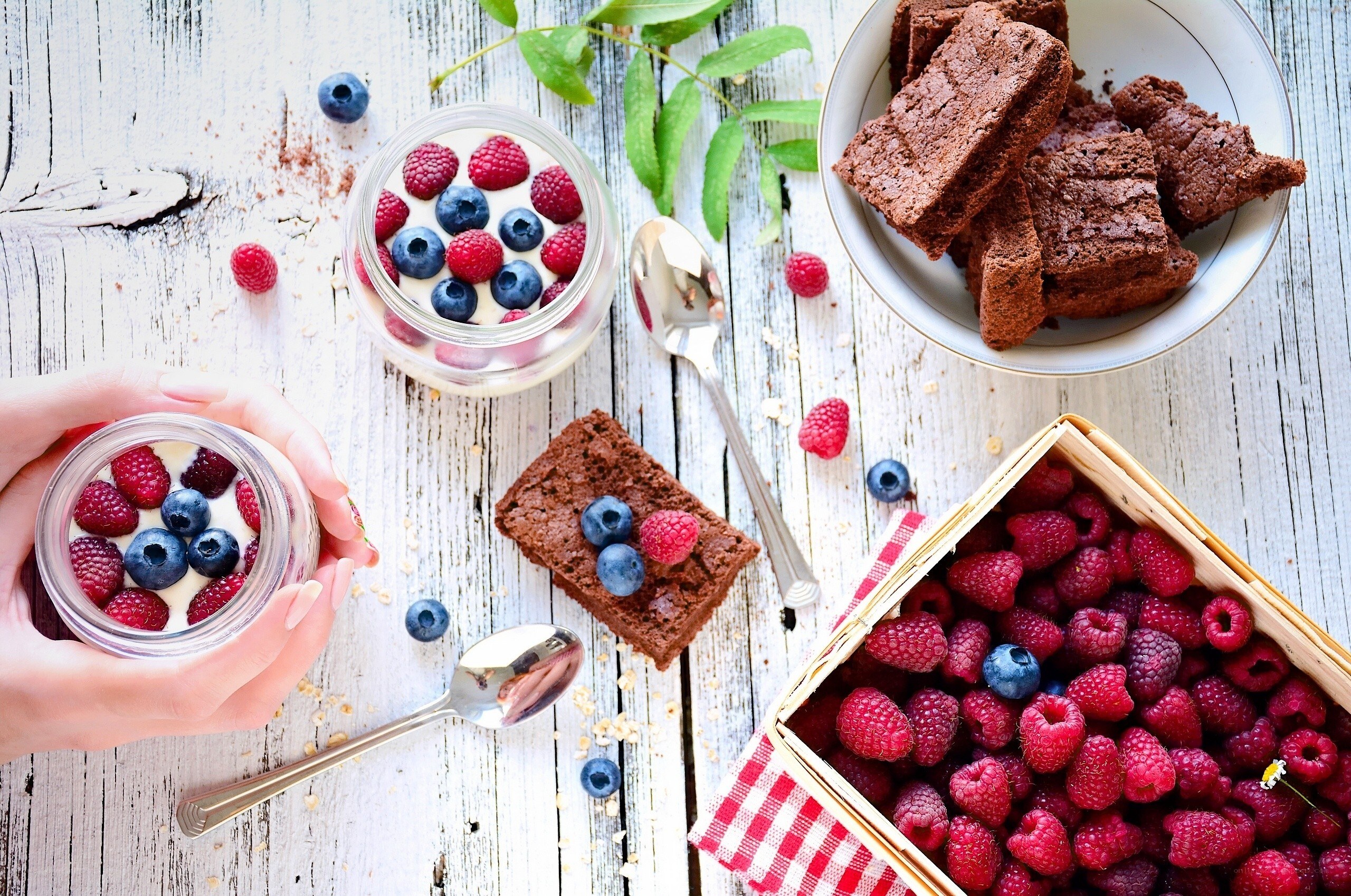 Berries and brownies on wood