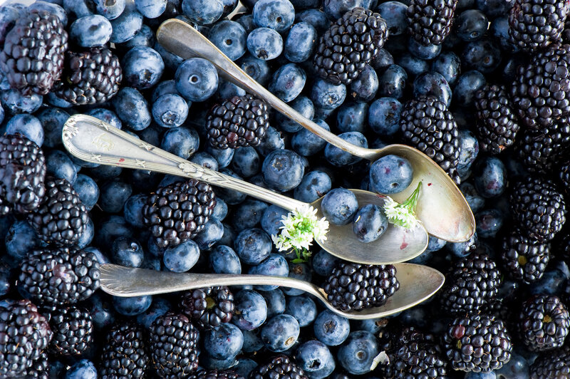 berries with spoons