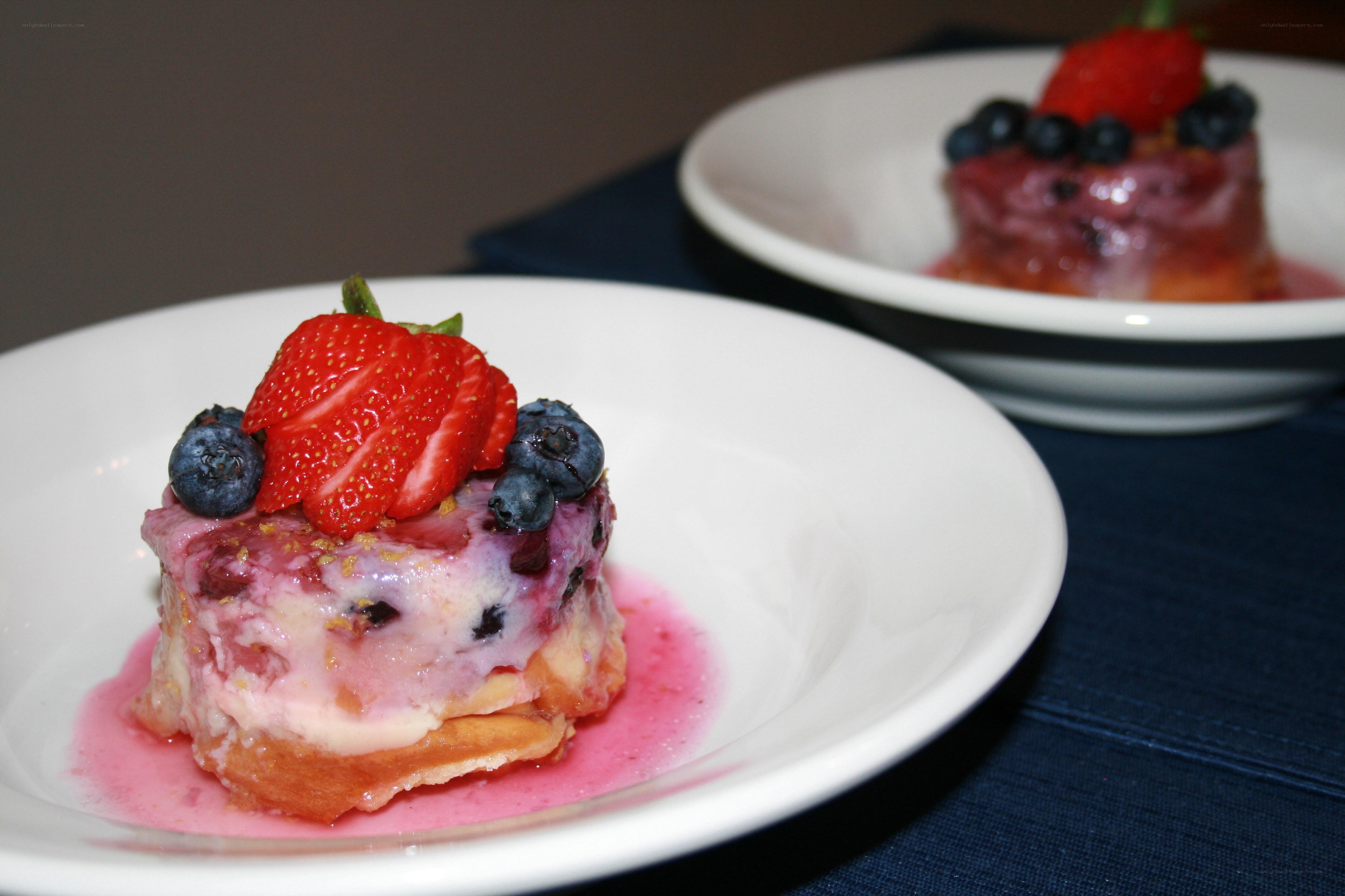 Berry-topped dessert on plates
