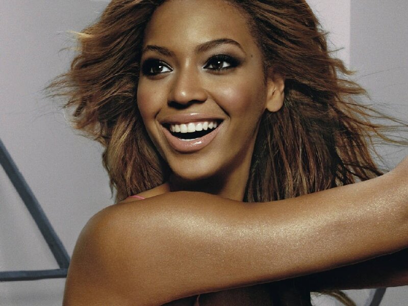 Beyoncé smiling with flowing hair