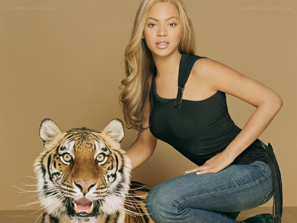 Beyoncé with a tiger cub