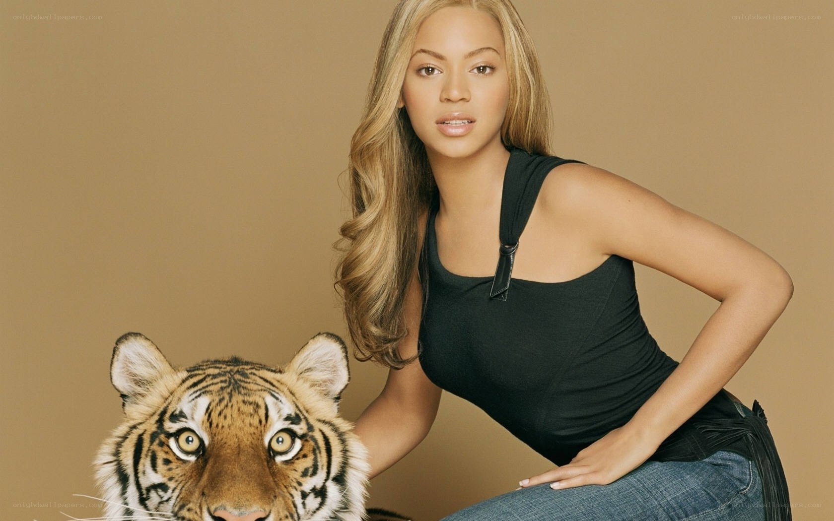 Beyoncé with a tiger cub