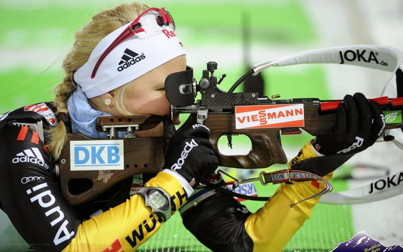 biathlete aiming rifle
