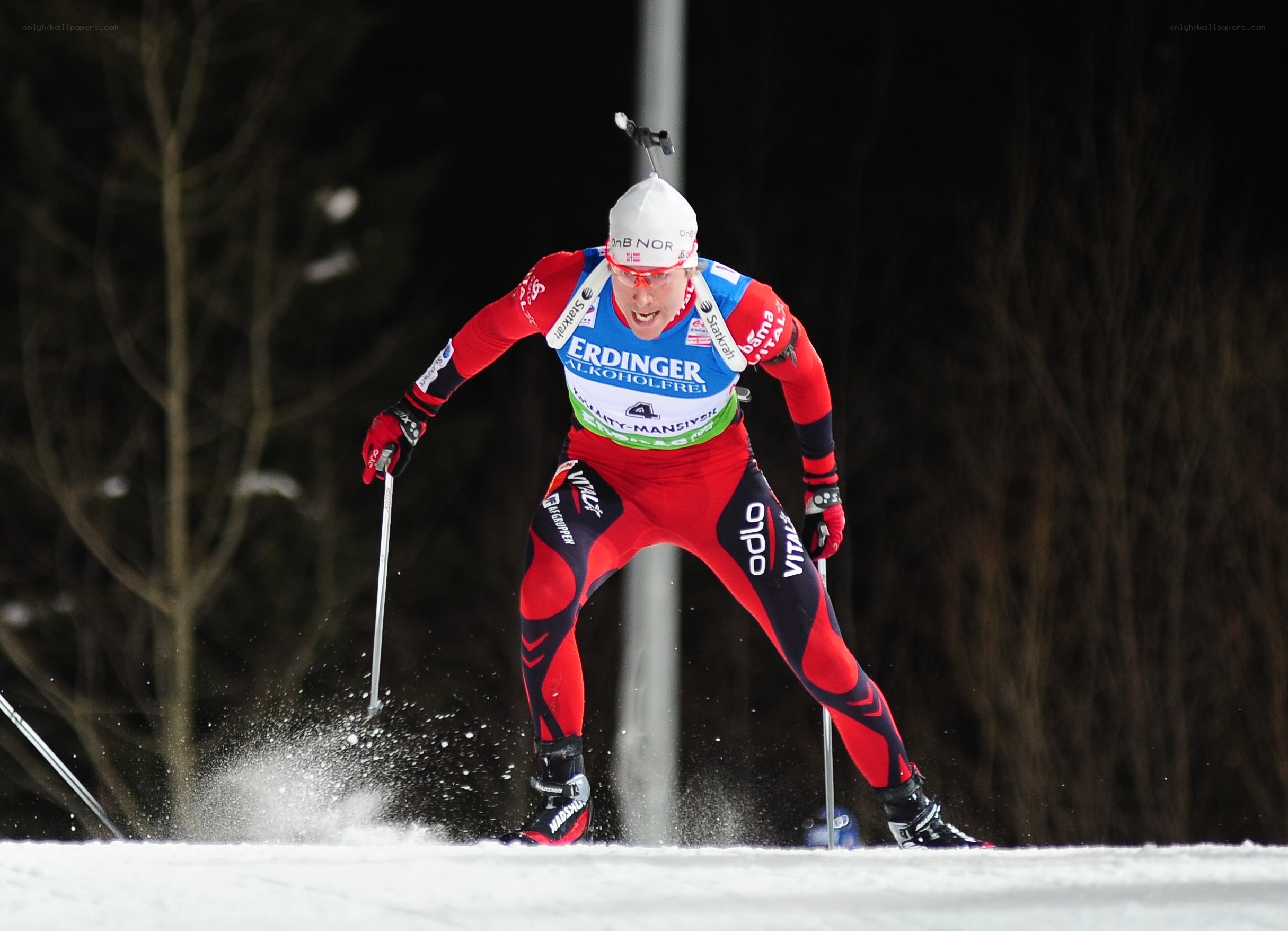 Biathlete in action at night