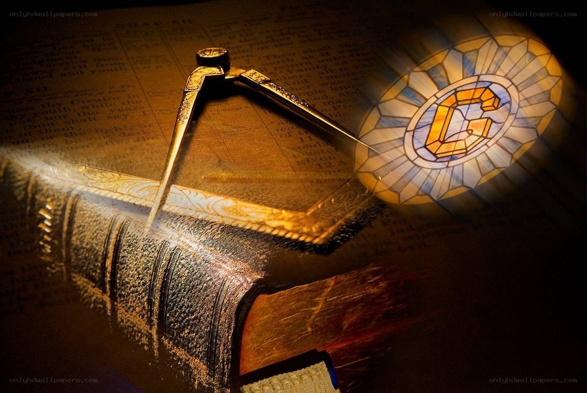 Bible with compass and stained glass