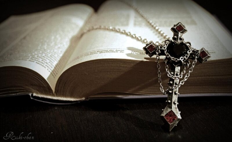 Bible with cross necklace