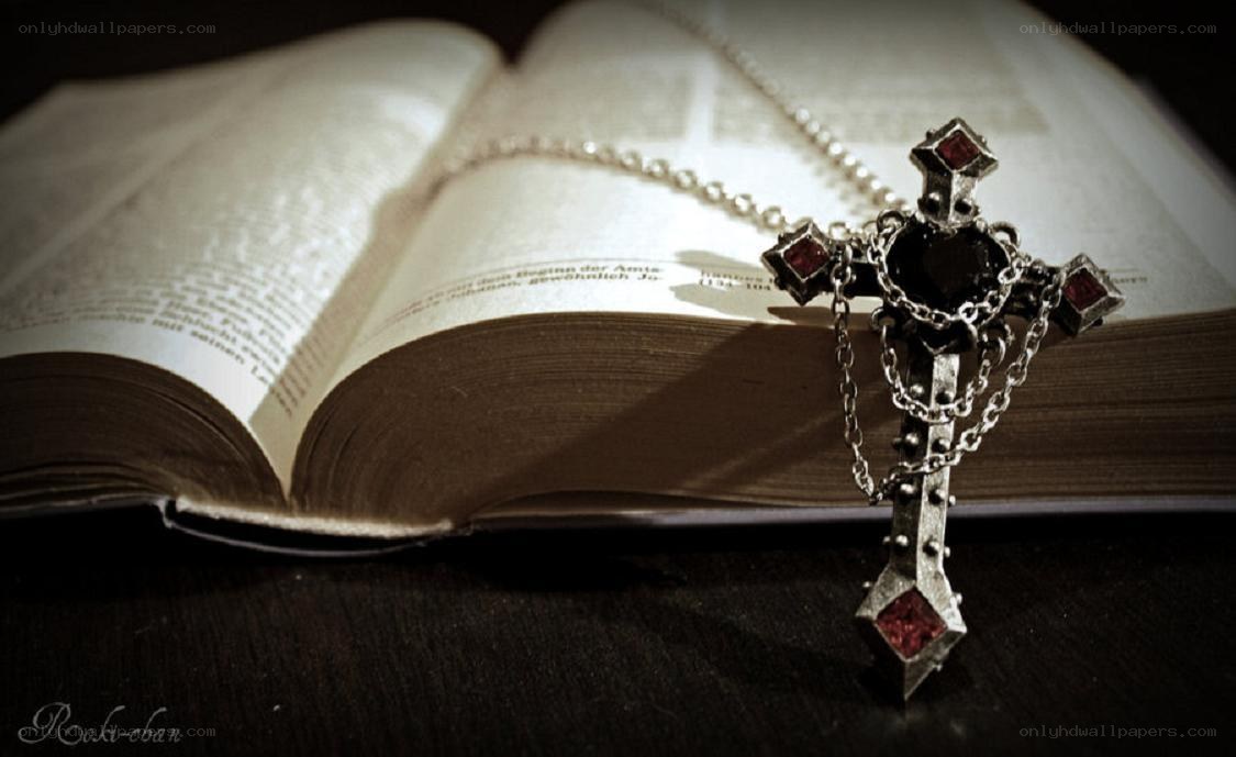 Bible with cross necklace