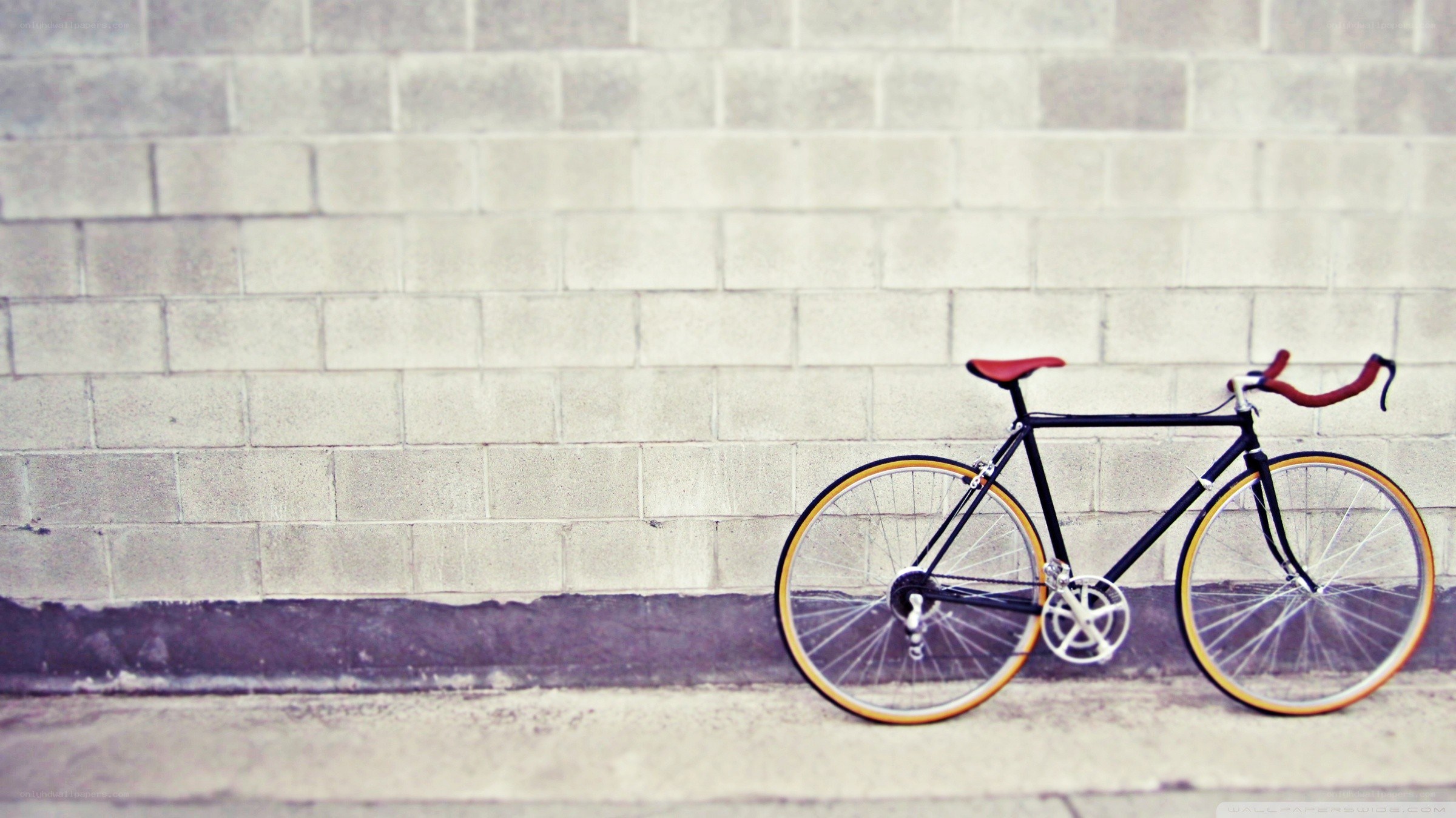 Bicycle against a brick wall