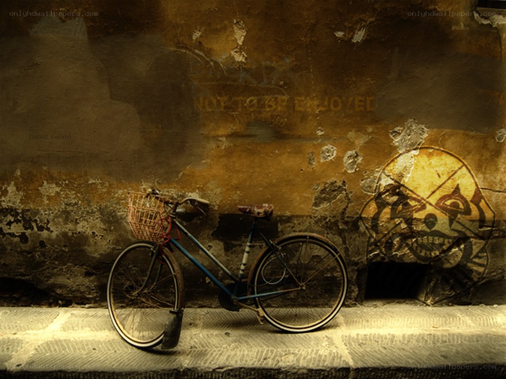Bicycle against a graffiti wall