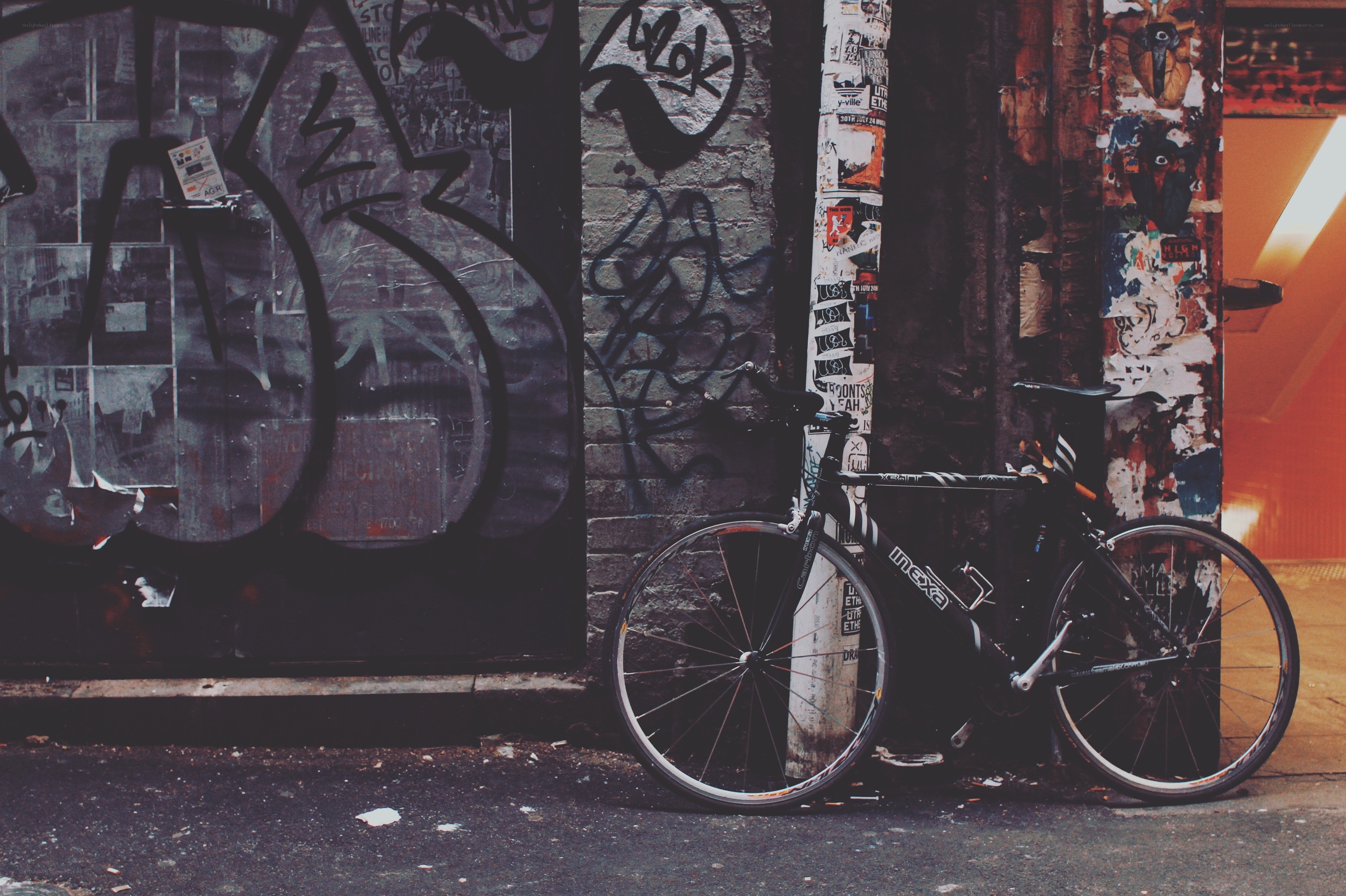 Bicycle against a graffiti wall