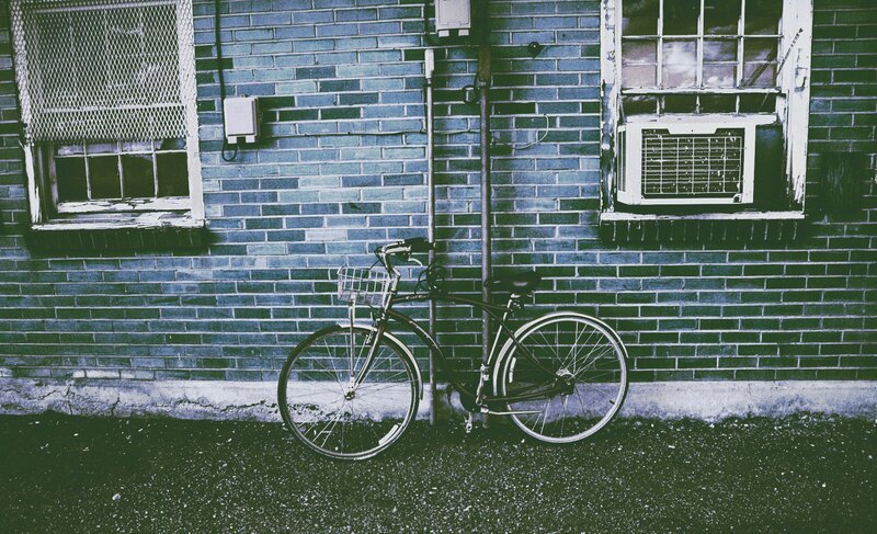 Bicycle Against Brick Wall — Blue