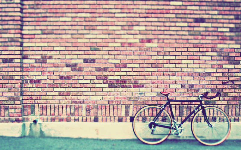 Bicycle Against Brick Wall — Red