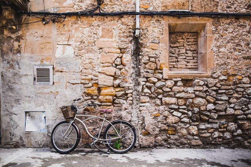 Bicycle against stone wall