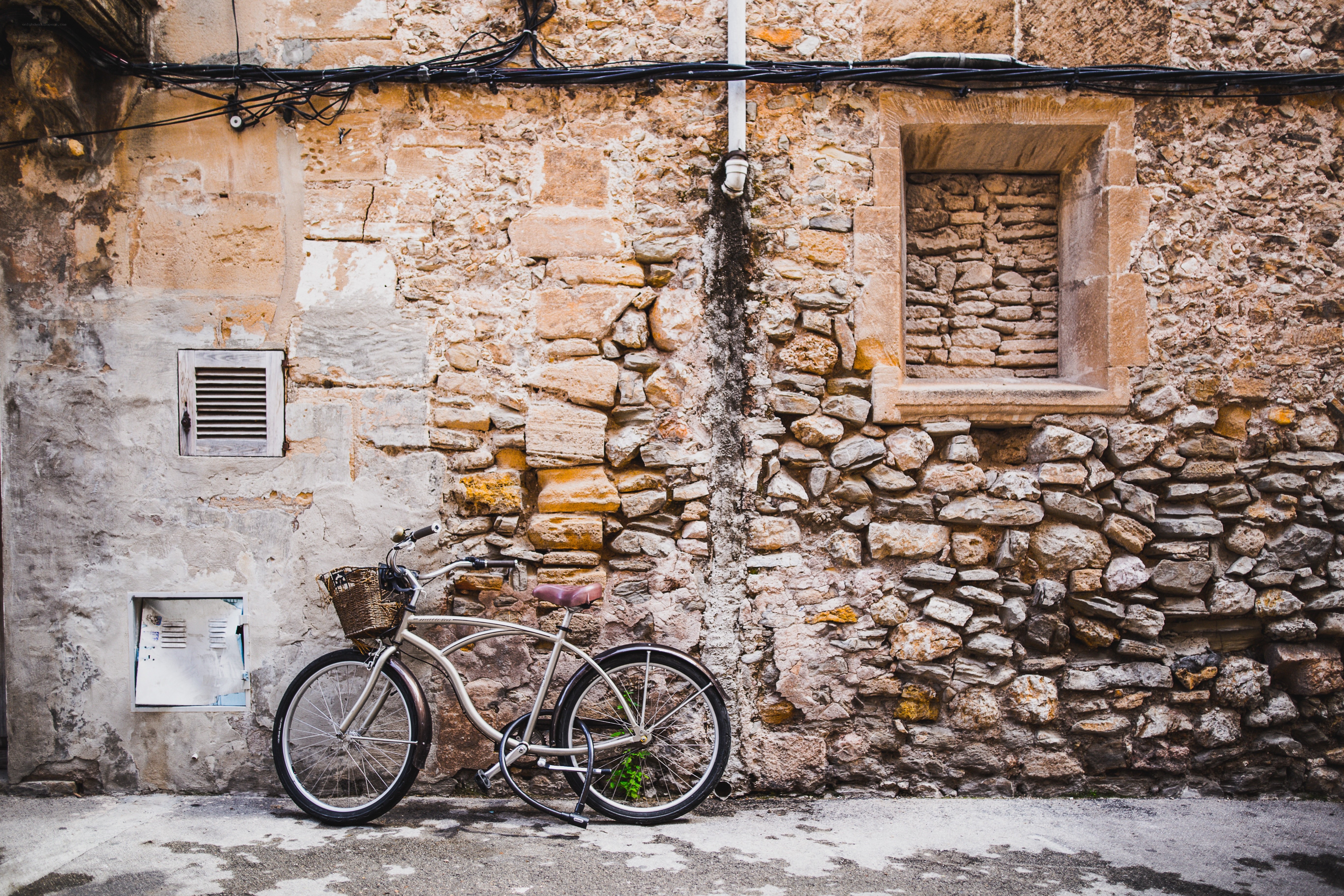 Bicycle against stone wall