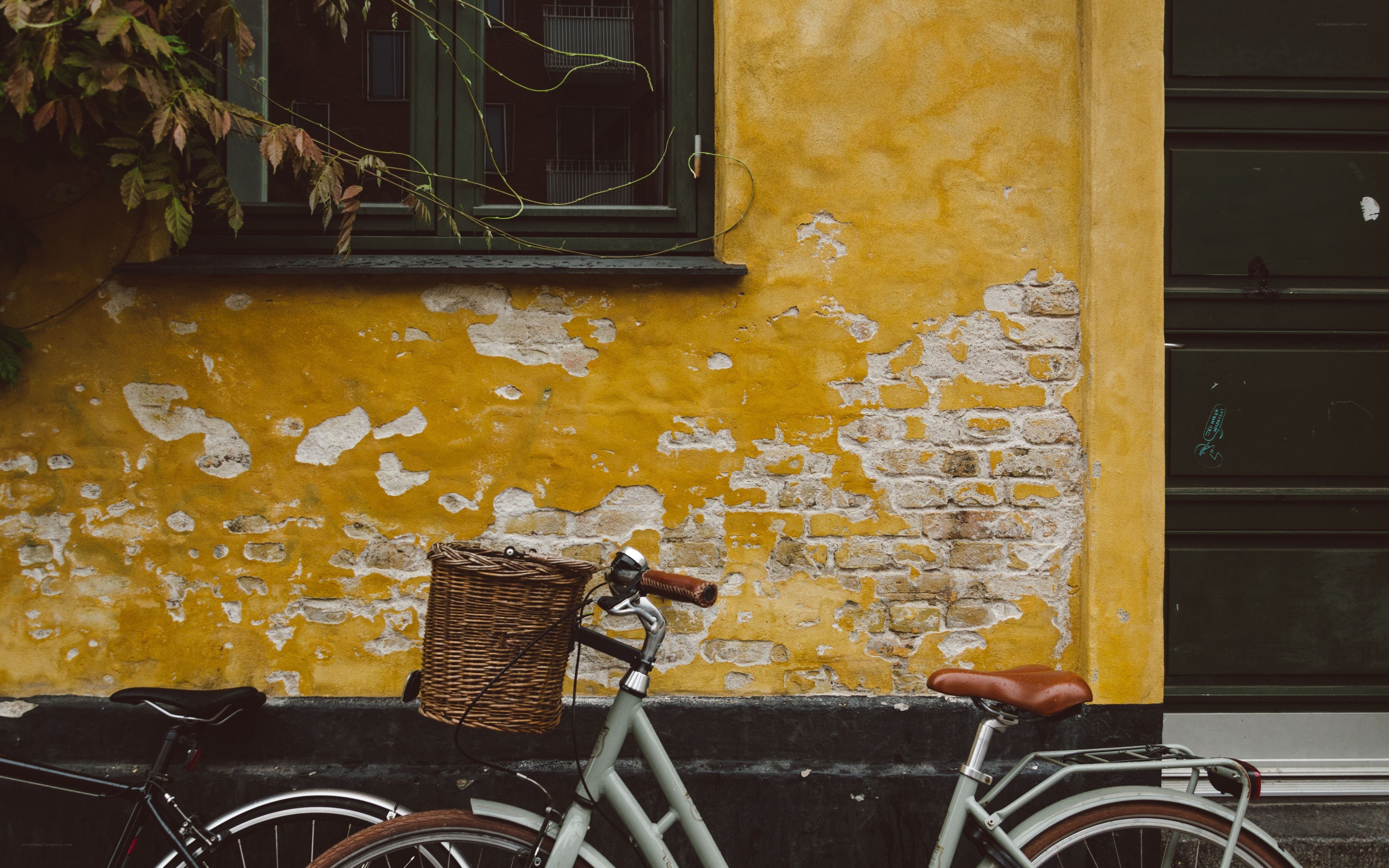 Bicycle against yellow wall