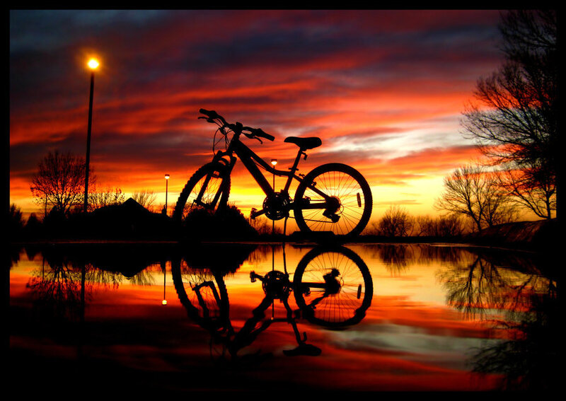 Bicycle at sunset with reflection