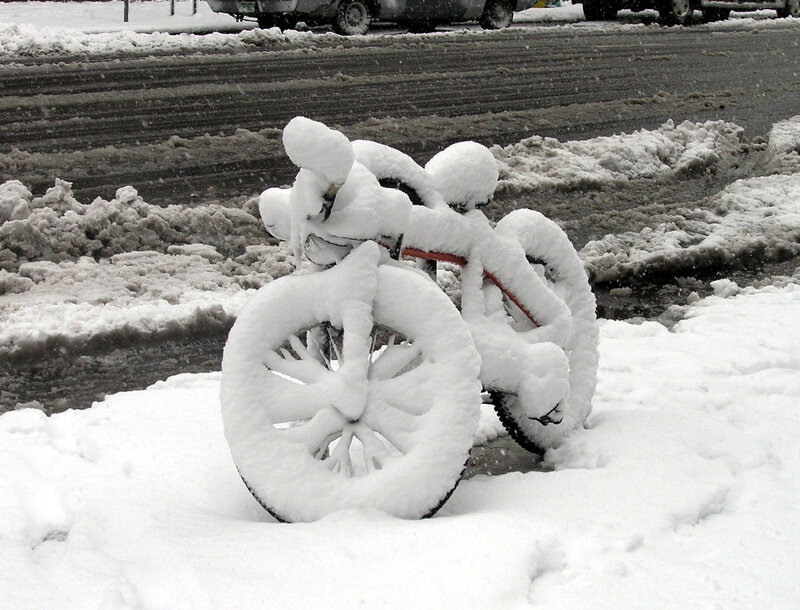 Bicycle buried in snow